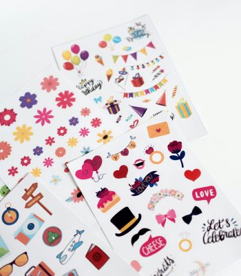 Vibrant sheets of celebration-themed stickers for art and craft activities.